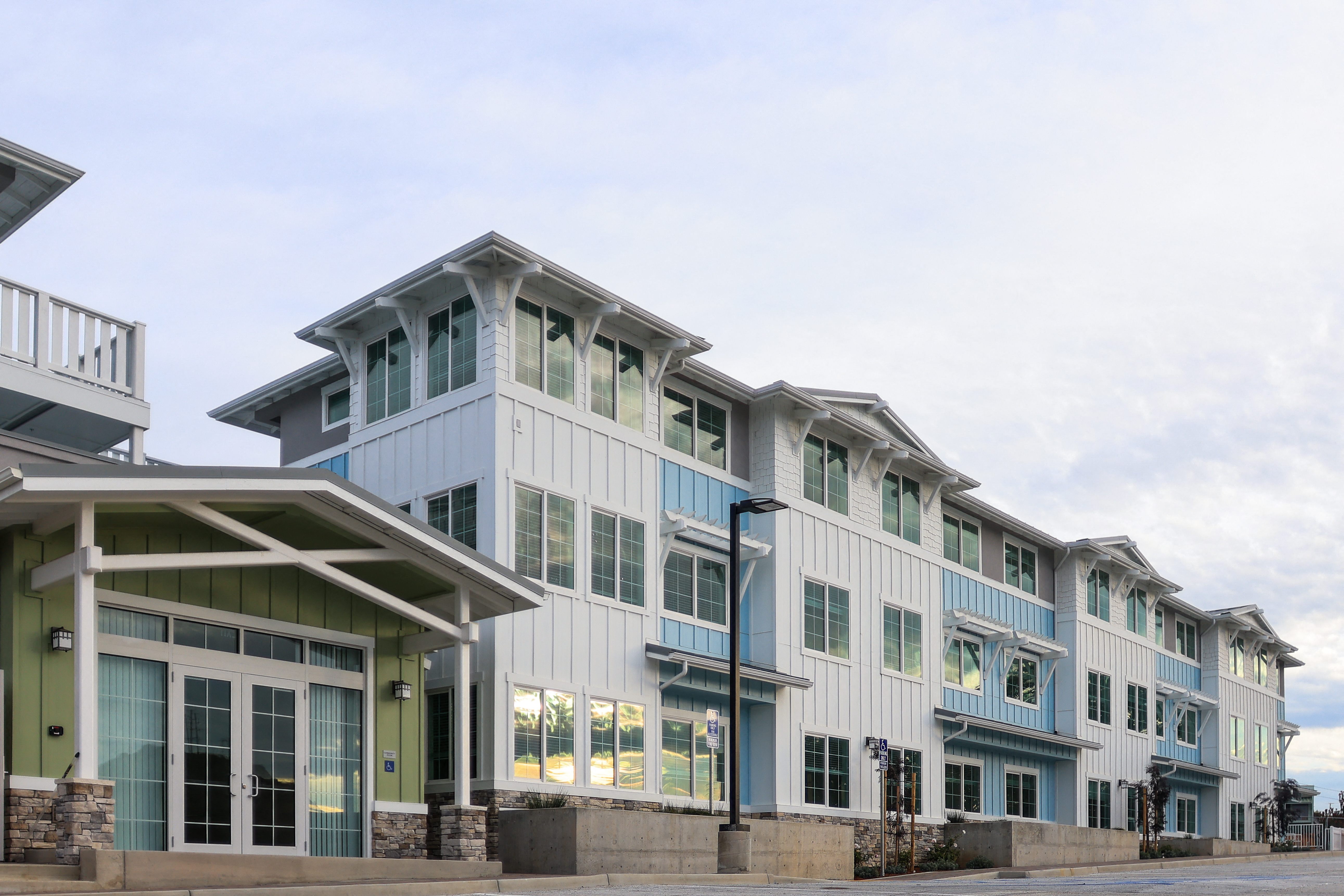 A row of modern buildings with blue and white trim.
